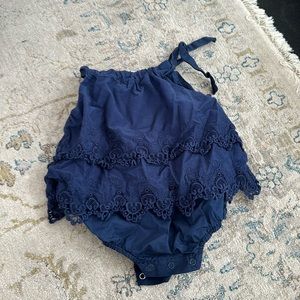 Girls sun romper with eye let edges